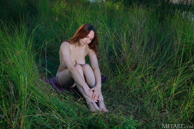 Perfect beauty posing naked outdoors, enjoying the touch of the grass and the fresh air 11